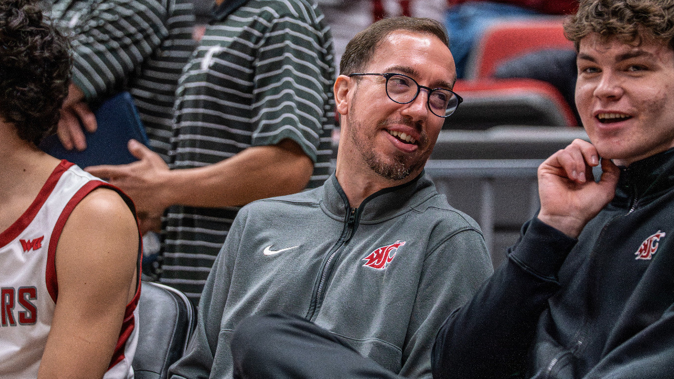 Pedro Garcia Rosado talks with Tomas Thrastarson on the bench